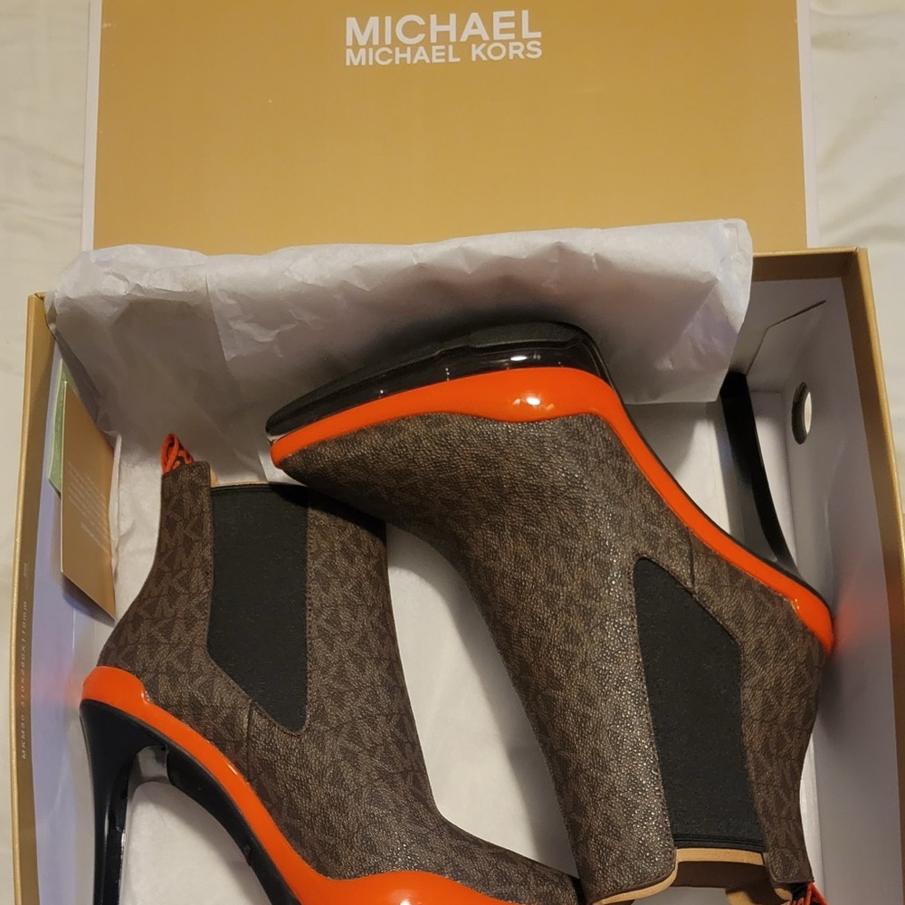 Michael Kors, size 6.5, brand new, hubby brought wrong size.